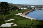 PEBBLE BEACH, CA - JUNE 17:  Tiger Woods plays his shot on the 18th green as Ernie Els of South Africa looks on during the first round of the 110th U.S. Open at Pebble Beach Golf Links on June 17, 2010 in Pebble Beach, California.  (Photo by Donald Miralle/Getty Images)