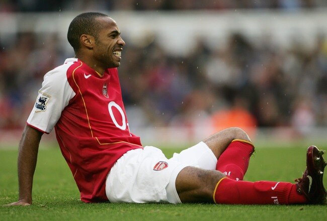 LONDON - OCTOBER 2:  Thierry Henry of Arsenal is injured during the Barclays Premiership match between Arsenal and Charlton Atheltic at Highbury on October 2, 2004 in London. (Photo by Shaun Botterill/Getty Images)