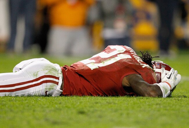 TUSCALOOSA, AL - NOVEMBER 05:  Dre Kirkpatrick #21 of the Alabama Crimson Tide is hurt after a punt during the game against the LSU Tigers at Bryant-Denny Stadium on November 5, 2011 in Tuscaloosa, Alabama.  (Photo by Streeter Lecka/Getty Images)