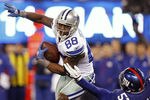 EAST RUTHERFORD, NJ - JANUARY 1:  Dez Bryant #88 of the Dallas Cowboys attempts to get by Jacquian Williams #57 of the New York Giants during a game at MetLife Stadium on January 1, 2012 in East Rutherford, New Jersey. (Photo by Rich Schultz /Getty Images)