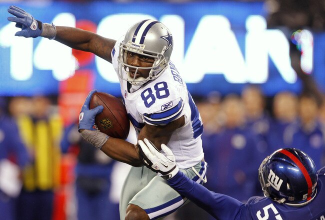 EAST RUTHERFORD, NJ - JANUARY 1:  Dez Bryant #88 of the Dallas Cowboys attempts to get by Jacquian Williams #57 of the New York Giants during a game at MetLife Stadium on January 1, 2012 in East Rutherford, New Jersey. (Photo by Rich Schultz /Getty Images)