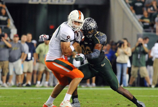 TAMPA, FL - NOVEMBER 19:  Tight end Chase Ford #9 of the Miami Hurricanes grabs a pass against the South Florida Bulls November 19, 2011 at Raymond James Stadium in Tampa, Florida.  Miami won 6 - 3. (Photo by Al Messerschmidt/Getty Images)
