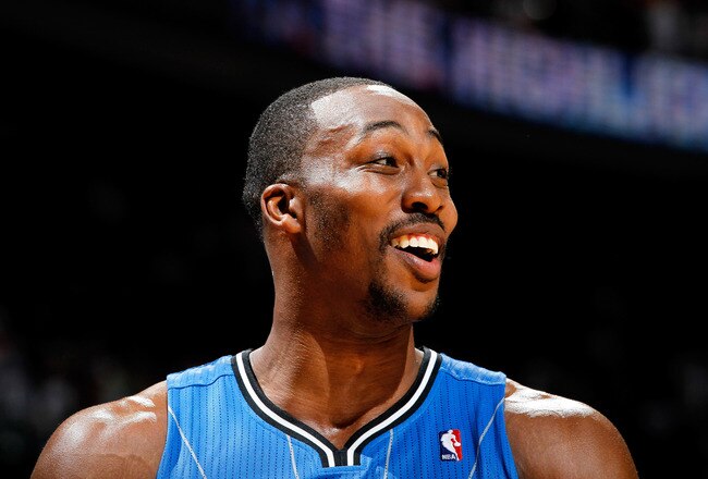ATLANTA, GA - APRIL 22:  Dwight Howard #12 of the Orlando Magic against the Atlanta Hawks during Game Three of the Eastern Conference Quarterfinals in the 2011 NBA Playoffs at Philips Arena on April 22, 2011 in Atlanta, Georgia.  NOTE TO USER: User expressly acknowledges and agrees that, by downloading and or using this photograph, User is consenting to the terms and conditions of the Getty Images License Agreement.  (Photo by Kevin C. Cox/Getty Images)