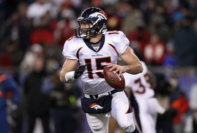 FOXBORO, MA - JANUARY 14: Tim Tebow #15 of the Denver Broncos looks to pass against the New England Patriots during their AFC Divisional Playoff Game at Gillette Stadium on January 14, 2012 in Foxboro, Massachusetts. (Photo by Elsa/Getty Images)
