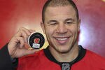CALGARY, CANADA - JANUARY 7: Jarome Iginla #12 of the Calgary Flames with the puck from his 500th goal scored against the Minnesota Wild during third period NHL action on January 7, 2012 at the Scotiabank Saddledome in Calgary, Alberta, Canada. (Photo by Mike Ridewood/Getty Images)