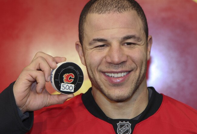 CALGARY, CANADA - JANUARY 7: Jarome Iginla #12 of the Calgary Flames with the puck from his 500th goal scored against the Minnesota Wild during third period NHL action on January 7, 2012 at the Scotiabank Saddledome in Calgary, Alberta, Canada. (Photo by Mike Ridewood/Getty Images)