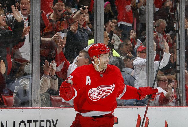 DETROIT, MI - DECEMBER 17:  Pavel Datsyuk #13 of the Detroit Red Wings celebrates his 2nd period goal against the Los Angeles Kings during their NHL game at Joe Louis Arena on December 17, 2011 in Detroit, Michigan.  (Photo by Dave Sandford/Getty Images)