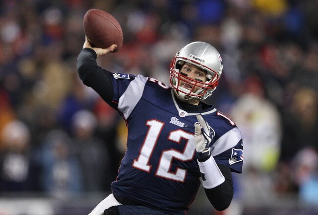FOXBORO, MA - JANUARY 14:  Tom Brady #12 of the New England Patriots throws a pass against the Denver Broncos during their AFC Divisional Playoff Game at Gillette Stadium on January 14, 2012 in Foxboro, Massachusetts.  (Photo by Elsa/Getty Images)