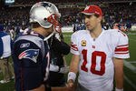 FOXBORO, MA - NOVEMBER 6:    Tom Brady #12 of the New England Patriots congratulates  Eli Manning #10 of the New York Giants after the New York Giants 24-20 win on November 6, 2011 in Foxboro, Massachusetts. (Photo by Jim Rogash/Getty Images)