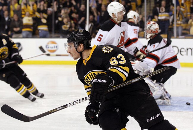 BOSTON, MA - NOVEMBER 15:  Brad Marchand #63 of the Boston Bruins celebrates his goal against Johan Hedberg #1 of the New Jersey Devils on November 15, 2011 at TD Garden in Boston, Massachusetts. The Boston Bruins defeated the New Jersey Devils 4-3.  (Photo by Elsa/Getty Images)