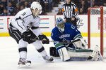 VANCOUVER, CANADA - JANUARY 17: Goalie Roberto Luongo #1 of the Vancouver Canucks stops Jack Johnson #3 the Los Angeles Kings during his shootout attempt in NHL action on January 17, 2012 at Rogers Arena in Vancouver, British Columbia, Canada.  (Photo by Rich Lam/Getty Images)