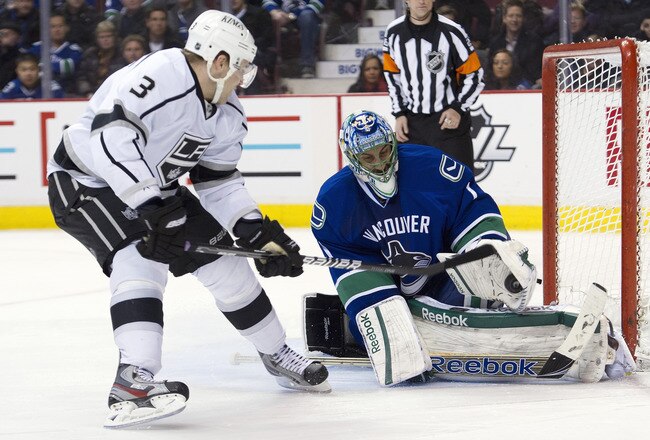 VANCOUVER, CANADA - JANUARY 17: Goalie Roberto Luongo #1 of the Vancouver Canucks stops Jack Johnson #3 the Los Angeles Kings during his shootout attempt in NHL action on January 17, 2012 at Rogers Arena in Vancouver, British Columbia, Canada.  (Photo by Rich Lam/Getty Images)
