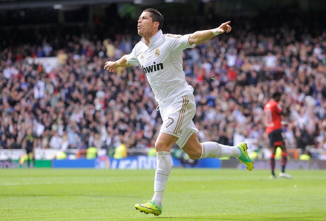 MADRID, SPAIN - NOVEMBER 06:  Cristiano Ronaldo of Real Madrid celebrates after scoring his third goal during the La Liga match between Real Madrid and Osasuna at Estadio Santiago Bernabeu on November 6, 2011 in Madrid, Spain.  (Photo by Denis Doyle/Getty Images)
