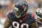 HOUSTON - OCTOBER 09:  Outside linebacker Mario Williams #90 of the  Houston Texans reacts after a big defensive stop in the first quarter against the Oakland Raiders at Reliant Stadium on October 9, 2011 in Houston, Texas.  (Photo by Bob Levey/Getty Images)