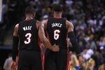 OAKLAND, CA - JANUARY 10:  LeBron James #6 of the Miami Heat talks to Dwyane Wade #3 of the Miami Heat during their game against the Golden State Warriors at Oracle Arena on January 10, 2012 in Oakland, California.  NOTE TO USER: User expressly acknowledges and agrees that, by downloading and or using this photograph, User is consenting to the terms and conditions of the Getty Images License Agreement.  (Photo by Ezra Shaw/Getty Images)