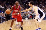 ORLANDO, FL - DECEMBER 18:  Jodie Meeks #20 of the Philadelphia 76ers looks to pass against J.J. Redick #7 of the Orlando Magic during the game at Amway Arena on December 18, 2010 in Orlando, Florida.  NOTE TO USER: User expressly acknowledges and agrees that, by downloading and or using this Photograph, user is consenting to the terms and conditions of the Getty Images License Agreement.  (Photo by Sam Greenwood/Getty Images)