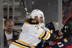 SUNRISE, FL - JANUARY 16:  Zdeno Chara #33 of the Boston Bruins checks Mike Weaver #43 of the Florida Panthers on January 16, 2012 at the BankAtlantic Center in Sunrise, Florida. The Bruins defeated the Panthers 3-2 in a shoot out. (Photo by Joel Auerbach/Getty Images)