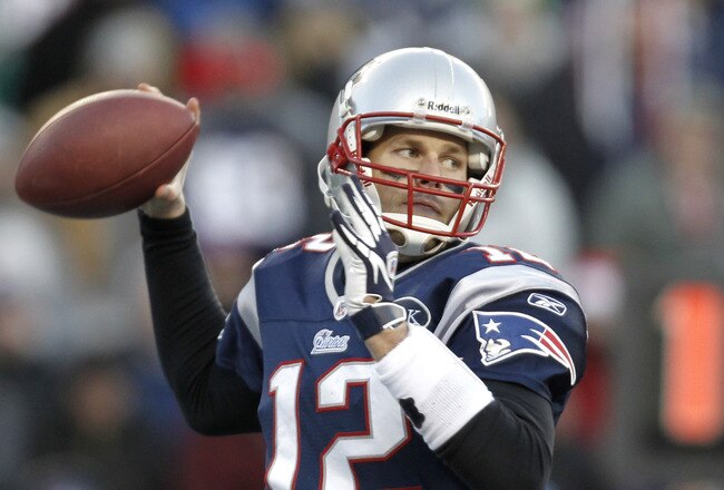 FOXBORO, MA - DECEMBER 24: Tom Brady #12 of the New England Patriots throws against the Miami Dolphins during the second half of New England's 27-24 win at Gillette Stadium on December 24, 2011 in Foxboro, Massachusetts.  (Photo by Winslow Townson/Getty Images)