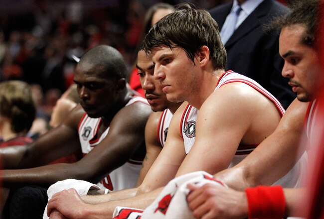 CHICAGO, IL - MAY 18:  (L-R) Luol Deng #9, Derrick Rose #1, Kyle Korver #26 and Joakim Noah #13 of the Chicago Bulls look on dejected from the bench late in the fourth quarter against the Miami Heat in Game Two of the Eastern Conference Finals during the 2011 NBA Playoffs on May 18, 2011 at the United Center in Chicago, Illinois. The Heat won 85-75. NOTE TO USER: User expressly acknowledges and agrees that, by downloading and or using this photograph, User is consenting to the terms and conditions of the Getty Images License Agreement.  (Photo by Gregory Shamus/Getty Images)