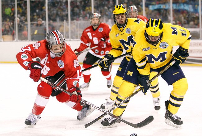 CLEVELAND, OH - JANUARY 15: Max McCormich #17 of the Ohio State Buckeys battles for the puck with Zach Hymann #11 of the Michigan Wolverines during the Frozen Diamond Faceoff at Progressive Field on January 15, 2012 in Cleveland, Ohio. (Photo by Gregory Shamus/Getty Images)