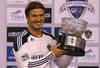 MELBOURNE, AUSTRALIA - DECEMBER 06:  David Beckham of the Galaxy poses with the man of the match trophy during the friendly match between the Melbourne Victory and LA Galaxy at Etihad Stadium on December 6, 2011 in Melbourne, Australia.  (Photo by Quinn Rooney/Getty Images)