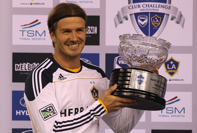 MELBOURNE, AUSTRALIA - DECEMBER 06:  David Beckham of the Galaxy poses with the man of the match trophy during the friendly match between the Melbourne Victory and LA Galaxy at Etihad Stadium on December 6, 2011 in Melbourne, Australia.  (Photo by Quinn Rooney/Getty Images)