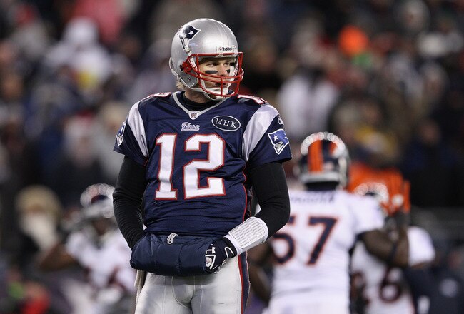 FOXBORO, MA - JANUARY 14:  Tom Brady #12 of the New England Patriots looks on against the Denver Broncos during their AFC Divisional Playoff Game at Gillette Stadium on January 14, 2012 in Foxboro, Massachusetts.  (Photo by Elsa/Getty Images)