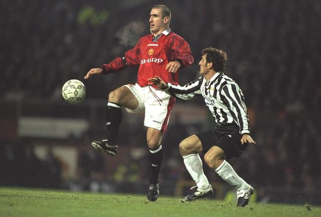 20 Nov 1996: Eric Cantona of United (left) gets to the ball ahead of Ciro Ferrara of Juventus during the champions league match between Manchester United and Juventus at Old Trafford, Manchester. Juventus won 0-1. Mandatory Credit: Graham Chadwick/Allsport