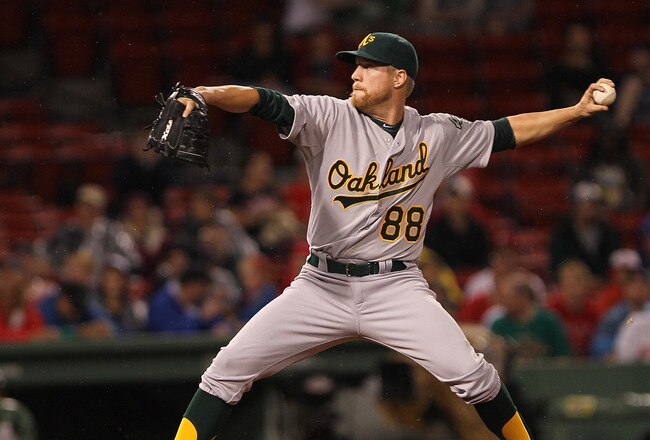 BOSTON, MA - AUGUST 27:  Josh Outman #88 of the Oakland Athletics throws against the Boston Red Sox at Fenway Park August 27, 2011 in Boston, Massachusetts. (Photo by Jim Rogash/Getty Images)