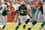 MIAMI GARDENS, FL - JANUARY 01:  LaDainian Tomlinson #21 of the New York Jets rushes during a game against the Miami Dolphins at Sun Life Stadium on January 1, 2012 in Miami Gardens, Florida.  (Photo by Mike Ehrmann/Getty Images)