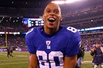 EAST RUTHERFORD, NJ - JANUARY 01:  Victor Cruz #80 of the New York Giants celebrates as he runs off of the field after defeating the Dallas Cowboys at MetLife Stadium on January 1, 2012 in East Rutherford, New Jersey.  (Photo by Al Bello/Getty Images)