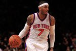 NEW YORK, NY - JANUARY 09:  Carmelo Anthony #7 of the New York Knicks dribbles against the Charlotte Bobcats at Madison Square Garden on January 9, 2012 in New York City. NOTE TO USER: User expressly acknowledges and agrees that, by downloading and or using this photograph, User is consenting to the terms and conditions of the Getty Images License Agreement.  (Photo by Chris Trotman/Getty Images)