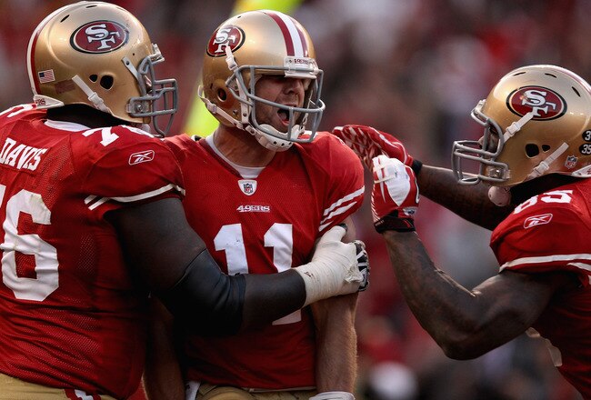 SAN FRANCISCO, CA - JANUARY 14:  Alex Smith #11 of the San Francisco 49ers celebrates his touchdown with teammates in the fourth quarter against the New Orleans Saints during the NFC Divisional playoff game at Candlestick Park on January 14, 2012 in San Francisco, California.  (Photo by Ezra Shaw/Getty Images)
