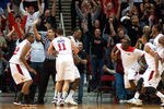 SAN DIEGO, CA - JANUARY 14: Jamaal Franklin #21 (C) of the San Diego State Aztecs celebrates with teammate James Rahon #11 after making the game winning shot with .3 seconds on the clock during the game against the UNLV Runnin' Rebels at Viejas Arena on January 14, 2012 in San Diego, California. (Photo by Kent C. Horner/Getty Images)
