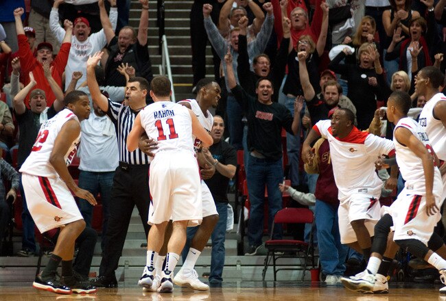 SAN DIEGO, CA - JANUARY 14: Jamaal Franklin #21 (C) of the San Diego State Aztecs celebrates with teammate James Rahon #11 after making the game winning shot with .3 seconds on the clock during the game against the UNLV Runnin' Rebels at Viejas Arena on January 14, 2012 in San Diego, California. (Photo by Kent C. Horner/Getty Images)