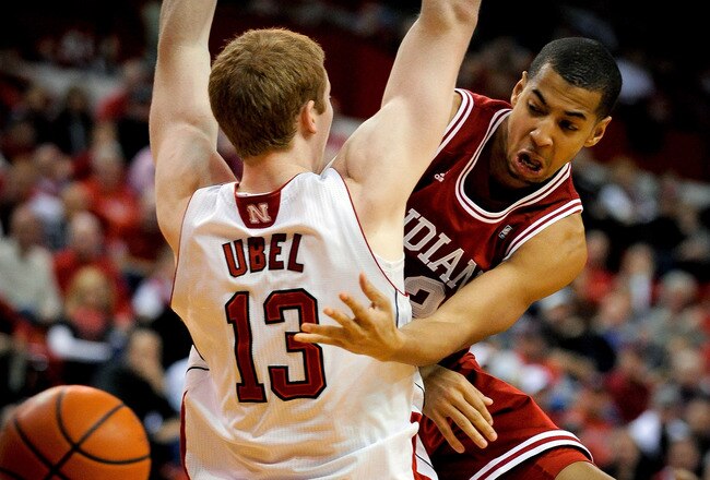 LINCOLN, NE - JANUARY 18: Verdell Jones III #12 of the Indiana Hoosiers passes the ball around Brandon Ubel #13 of the Nebraska Cornhuskers during their game at The Devany Center January 18, 2012 in Lincoln, Nebraska. (Photo by Eric Francis/Getty Images)