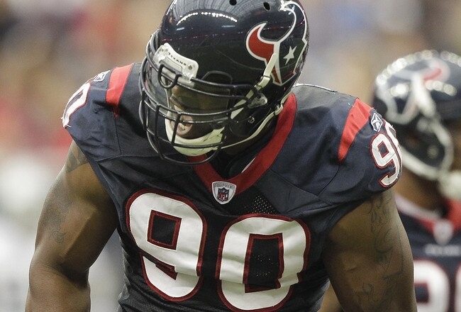 HOUSTON - OCTOBER 09: Outside linebacker Mario Williams #90 of the Houston Texans reacts after a big defensive stop in the first quarter against the Oakland Raiders at Reliant Stadium on October 9, 2011 in Houston, Texas. (Photo by Bob Levey/Getty Images)