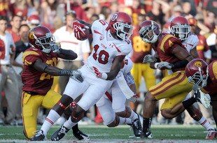 LOS ANGELES, CA - SEPTEMBER 10:  DeVonte Christopher #10 of the Utah Utes turns away from Nickell Robey #21 of the USC Trojans at Los Angeles Memorial Coliseum on September 10, 2011 in Los Angeles, California.  (Photo by Harry How/Getty Images)