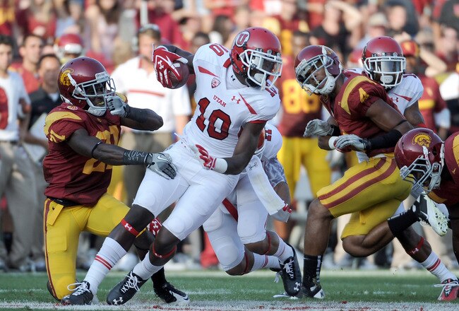 LOS ANGELES, CA - SEPTEMBER 10:  DeVonte Christopher #10 of the Utah Utes turns away from Nickell Robey #21 of the USC Trojans at Los Angeles Memorial Coliseum on September 10, 2011 in Los Angeles, California.  (Photo by Harry How/Getty Images)