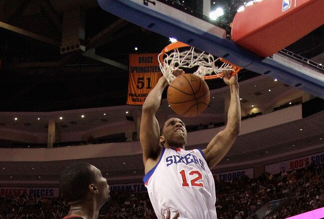 PHILADELPHIA, PA - APRIL 24: Evan Turner #12 of the Philadelphia 76ers dunks in front of Chris Bosh #1 of the Miami Heat during the second half of Game Four of the Eastern Conference Quarterfinals in the 2011 NBA Playoffs at Wells Fargo Center on April 24, 2011 in Philadelphia, Pennsylvania. NOTE TO USER: User expressly acknowledges and agrees that, by downloading and/or using this Photograph, User is consenting to the terms and conditions of the Getty Images License Agreement.  (Photo by Rob Carr/Getty Images)