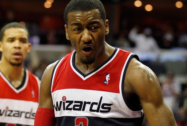 WASHINGTON, DC - JANUARY 06: John Wall #2 of the Washington Wizards reacts after making a basket against the New York Knicks during the second half at Verizon Center on January 6, 2012 in Washington, DC.  NOTE TO USER: User expressly acknowledges and agrees that, by downloading and or using this photograph, User is consenting to the terms and conditions of the Getty Images License Agreement.  (Photo by Rob Carr/Getty Images)