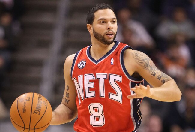 PHOENIX, AZ - JANUARY 13:  Deron Williams #8 of the New Jersey Nets in action during the NBA game against the Phoenix Suns at US Airways Center on January 13, 2012 in Phoenix, Arizona. The Nets defeated the Suns 110-103.   NOTE TO USER: User expressly acknowledges and agrees that, by downloading and or using this photograph, User is consenting to the terms and conditions of the Getty Images License Agreement.  (Photo by Christian Petersen/Getty Images)