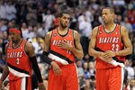 DALLAS, TX - APRIL 19:  (L-R) Gerald Wallace #3, LaMarcus Aldridge #12 and Marcus Camby #23 of the Portland Trail Blazers during a loss against the Dallas Mavericks in Game Two of the Western Conference Quarterfinals during the 2011 NBA Playoffs on April 19, 2011 at American Airlines Center in Dallas, Texas.  NOTE TO USER: User expressly acknowledges and agrees that, by downloading and or using this photograph, User is consenting to the terms and conditions of the Getty Images License Agreement.  (Photo by Ronald Martinez/Getty Images)