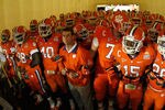MIAMI GARDENS, FL - JANUARY 04:  Head coach Dabo Swinney (C) of the Clemson Tigers gets set to lead his team onto the field against the West Virginia Mountaineers West Virginia Mountaineers during the Discover Orange Bowl at Sun Life Stadium on January 4, 2012 in Miami Gardens, Florida.  (Photo by Mike Ehrmann/Getty Images)