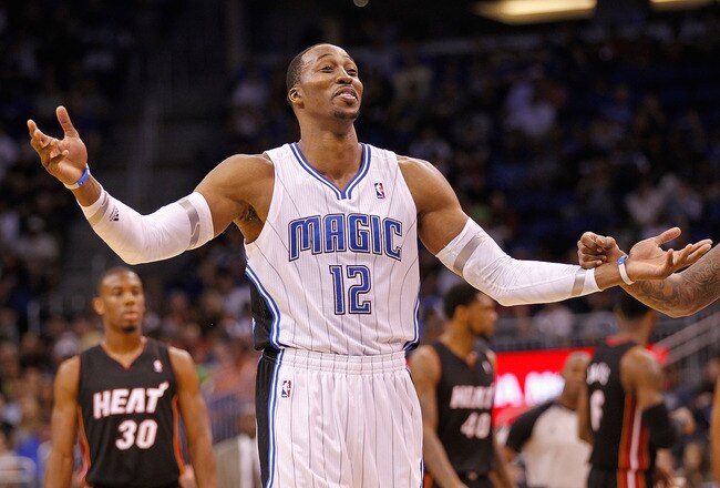 ORLANDO, FL - DECEMBER 21: Dwight Howard #12 of the Orlando Magic argues a call during a preseason game against the Miami Heat at Amway Center on December 21, 2011 in Orlando, Florida. NOTE TO USER: User expressly acknowledges and agrees that, by downloading and/or using this Photograph, User is consenting to the terms and conditions of the Getty Images License Agreement.  (Photo by Mike Ehrmann/Getty Images)