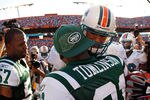 MIAMI GARDENS, FL - JANUARY 01:  Jason Taylor #99 of the Miami Dolphins shakes hands with  LaDainian Tomlinson #21 of the New York Jets after a game  at Sun Life Stadium on January 1, 2012 in Miami Gardens, Florida.  (Photo by Mike Ehrmann/Getty Images)