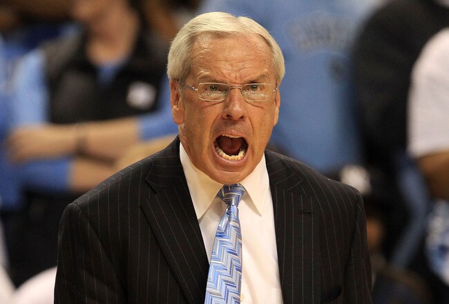 GREENSBORO, NC - MARCH 12:  Head coach Roy Williams of the North Carolina Tar Heels reacts during overtime against the Clemson Tigers in the semifinals of the 2011 ACC men's basketball tournament at the Greensboro Coliseum on March 12, 2011 in Greensboro, North Carolina.  (Photo by Streeter Lecka/Getty Images)