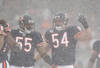 CHICAGO, IL - DECEMBER 12: Brian Urlacher #54 of the Chicago Bears calls a defensive play as teammate Lance Briggs #55 moves into position against the New England Patriots at Soldier Field on December 12, 2010 in Chicago, Illinois. The Patriots defeated the Bears 36-7. (Photo by Jonathan Daniel/Getty Images)