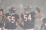 CHICAGO, IL - DECEMBER 12: Brian Urlacher #54 of the Chicago Bears calls a defensive play as teammate Lance Briggs #55 moves into position against the New England Patriots at Soldier Field on December 12, 2010 in Chicago, Illinois. The Patriots defeated the Bears 36-7. (Photo by Jonathan Daniel/Getty Images)