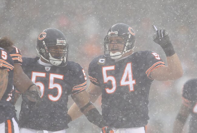 CHICAGO, IL - DECEMBER 12: Brian Urlacher #54 of the Chicago Bears calls a defensive play as teammate Lance Briggs #55 moves into position against the New England Patriots at Soldier Field on December 12, 2010 in Chicago, Illinois. The Patriots defeated the Bears 36-7. (Photo by Jonathan Daniel/Getty Images)